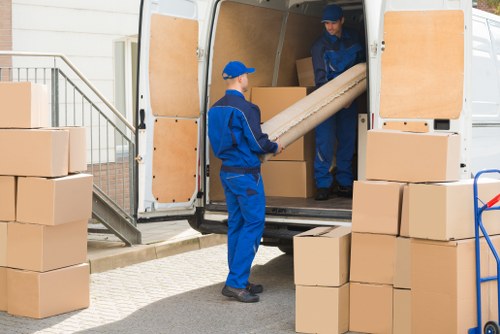 House removals team preparing a move in Acton street