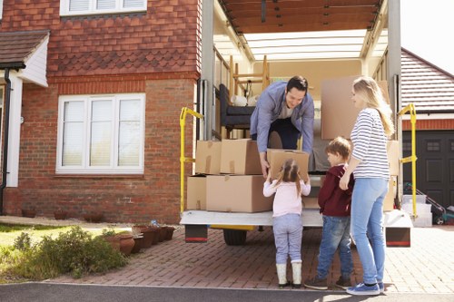 Acton Removals staff reviewing ethical labour compliance documents