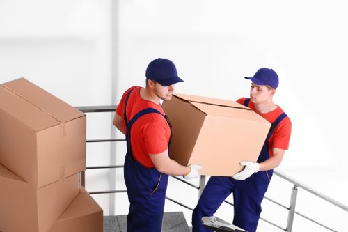 Professional movers loading furniture safely in Acton