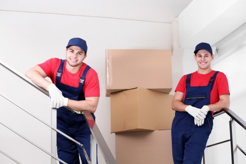 Team carrying furniture during an Acton relocation