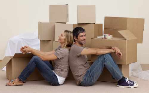 Business relocation team handling office equipment in Acton