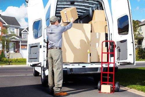 Local house removalists in Acton unloading furniture at a new home
