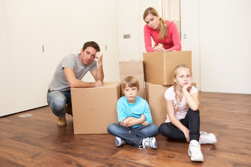 Professional team loading furniture for pick-up in Acton