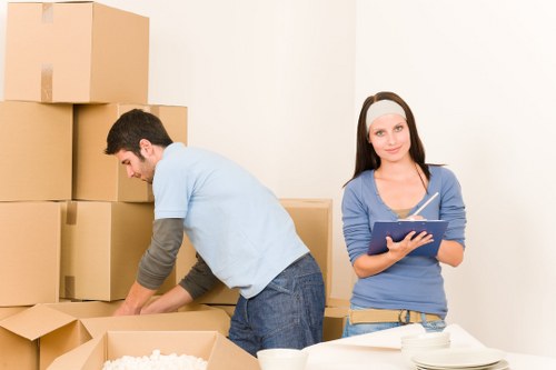 Loading furniture into a van in Acton