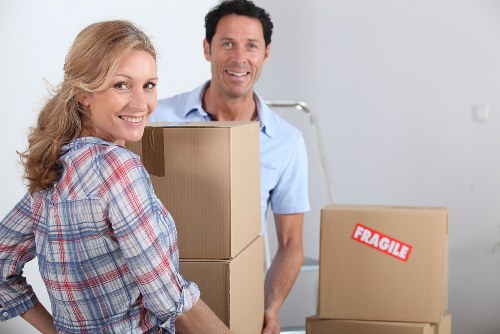 Packed moving boxes prepared for a home move in Acton
