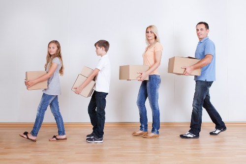 Acton removal team loading furniture into a moving truck