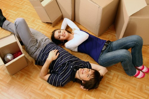 Careful packing of fragile items for house removals in Acton