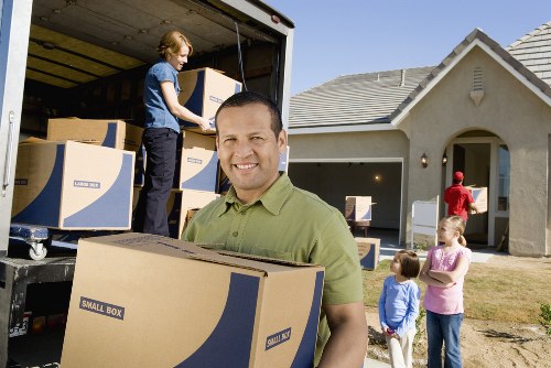 Packed moving boxes and furniture for Acton relocation